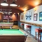 Interior seating area of a pub with two pool tables.