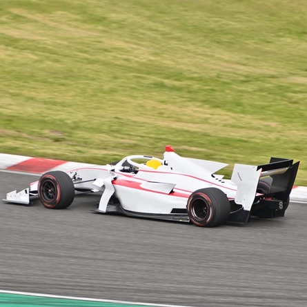 A Formula One car racing on a track.
