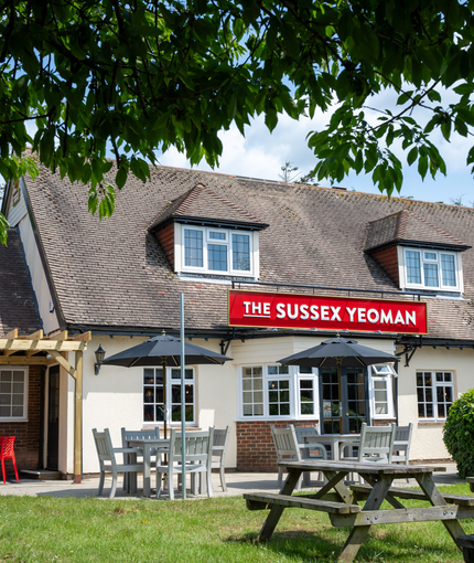 The exterior facade, beer garden seating area at the Sussex Yeoman.