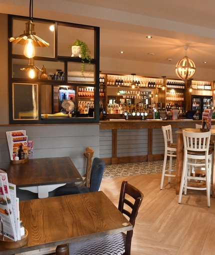 interior restaurant with seating area and bar