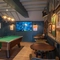 An image of the seating and games area with TV and pool table at The Old Red Lion.
