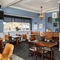 Interior dining area of a pub with a TV.