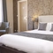 A hotel room in the Sun Hotel.