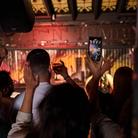 An interior shot of a crowd watching a performance during the Q3 Live Music Event at one of the Greene King Pubs.