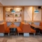The interior restaurant seating area booths with cushioned seating at The Farmhouse Kitchen Willington.