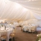 A marquee, decorated for a wedding.