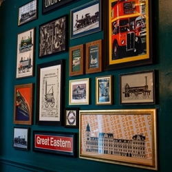 Interior decor of the Railway Tavern with pictures and frames on the wall.