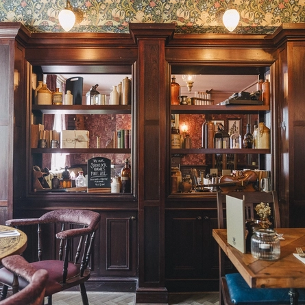 The interior restaurant seating area and decor of the Sherlock Holmes.