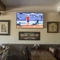 Interior dining area of a pub with a TV.