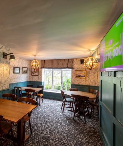 interior restaurant and seating area with TV