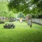 Exterior beer garden and playground of a pub with a seating area.