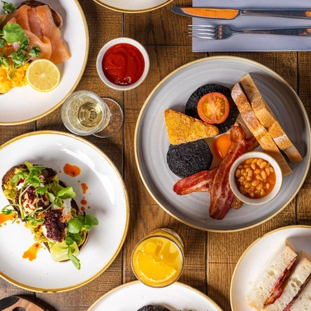 Various plated Brunch Dishes including a Full English, Vegetarian Full English, Bacon Sandwich, Sausage Sandwich, Smoked Salmon, Avocado On Toast and Croissant with jam at Crafted venues.