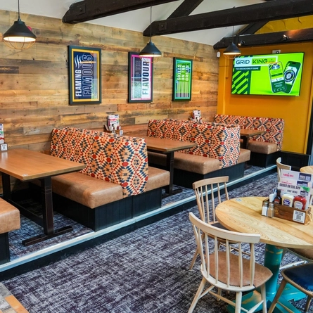 The interior restaurant and seating area with TV at the Pack Horse.
