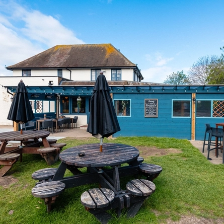 The exterior of the venue and beer garden seating area at The Wheatsheaf.