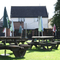 Exterior beer garden of a pub with a seating area.