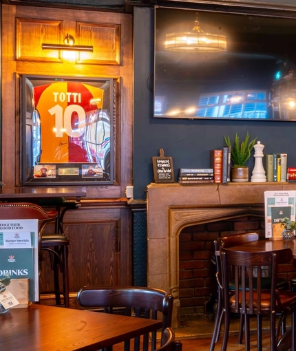The interior restaurant and seating area with TV's at the Fitzrovia.
