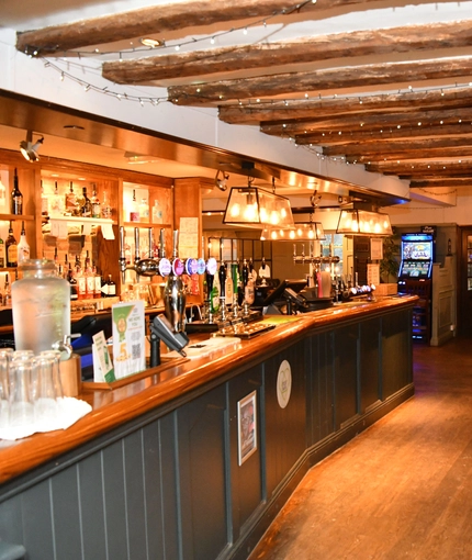 interior dining area of a pub with a bar