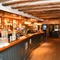 interior dining area of a pub with a bar