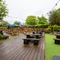 Exterior beer garden and a play area of a pub with a seating area.