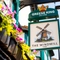 A close up view of the pub sign on the exterior wall of The Windmill Inn. The sign features an illustration of a windmill above the words "The Windmill, York", on a white background.