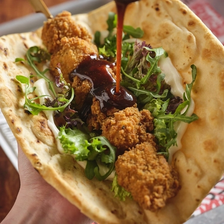 A  southern fried chicken skewer flat bread served at Flaming Grill.