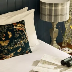 The bed of a hotel room in a Chef & Brewer Pubs With Rooms.