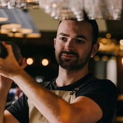 Crafted - Bartender making a drink