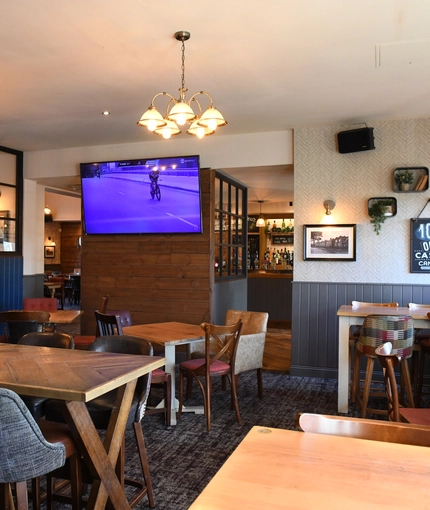 interior restaurant and seating area with TV