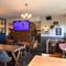 interior restaurant and seating area with TV