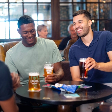 An image of 3 people sat within the interior seating area with drinks at a Community Pubs With Food venue.
