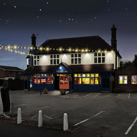 The exterior facade and car park at The Victory Inn.