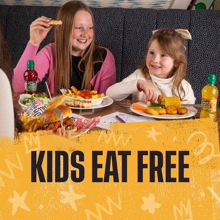 A banner promoting kids-eat-free at Flaming Grill venues.