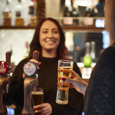 Staff member at the bar.