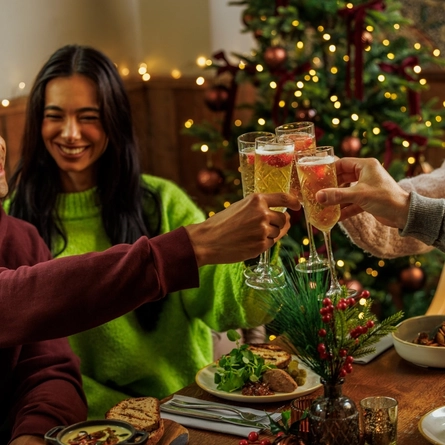 An image of people enjoying various festive starters and drinks within the interior restaurant seating area during Christmas time at The Watermill.