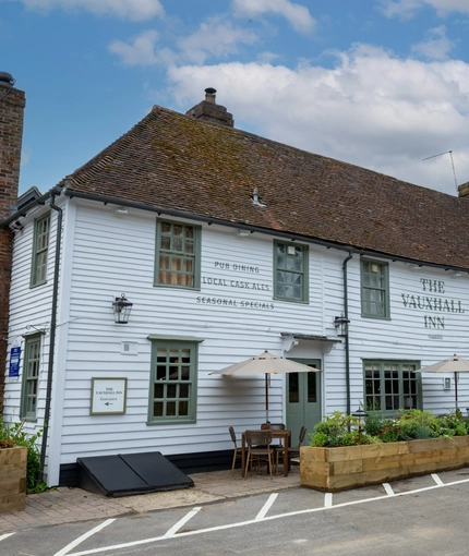 The exterior facade and seating area at the Vauxhall Inn.