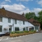 The exterior facade and seating area at the Vauxhall Inn.