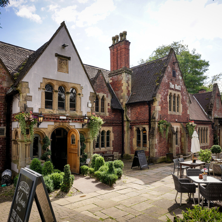 The exterior and part of the beer garden of The Hutt.