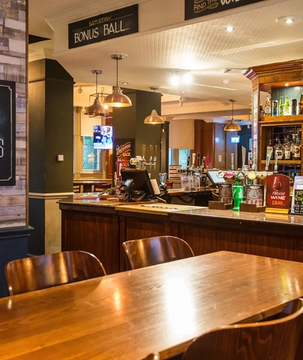 interior seating area and bar of the pub