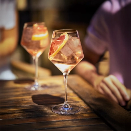 A lifestyle image of 2 glasses of Pernod x Metropolitan cocktails available at Metro venues.