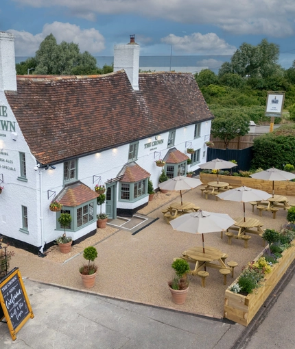 The exterior birds eye view with seating area at the Crown Inn.