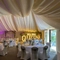 A marquee, decorated for a wedding.