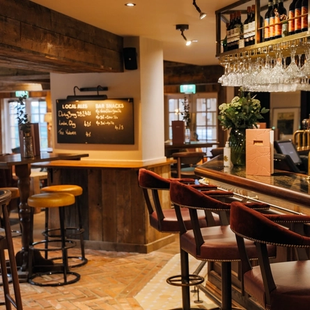 interior dining area of a pub with a bar area