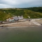 Birdseye view of the venue, with scenic views of the waterside and hills surrounding 