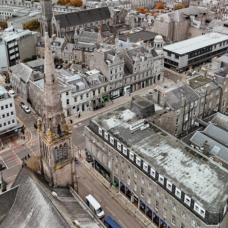 An aerial view of the exterior of Molly Malones and the surrounding buildings and streets.