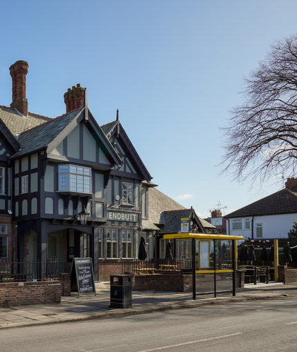Exterior of the pub with the name above the entrance.