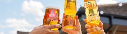 An exterior shot of people enjoying alcoholic drinks served in a beer garden at the Mill House in Stretton.