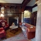 A seating area and fireplace inside The Rothley Court Hotel.