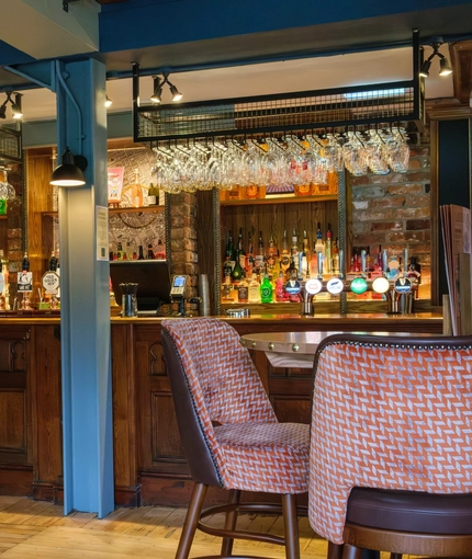 An image of the interior bar and seating area at The Guild.