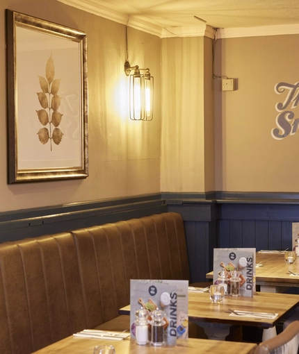 The interior restaurant seating area at The Caledonian Hotel.