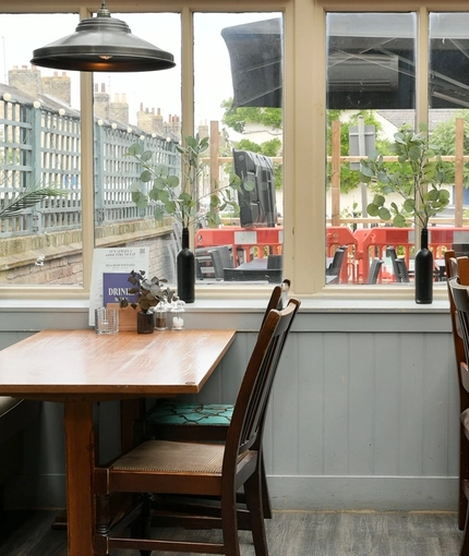 The interior conservatory restaurant seating area at The Duke Of Cambridge.